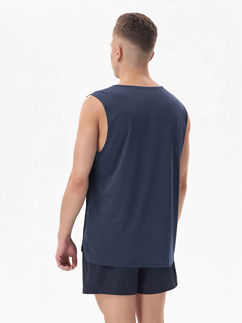 Man wearing a double-color breathable gym tank top, showcasing back view design, ideal for workouts and staying cool.
